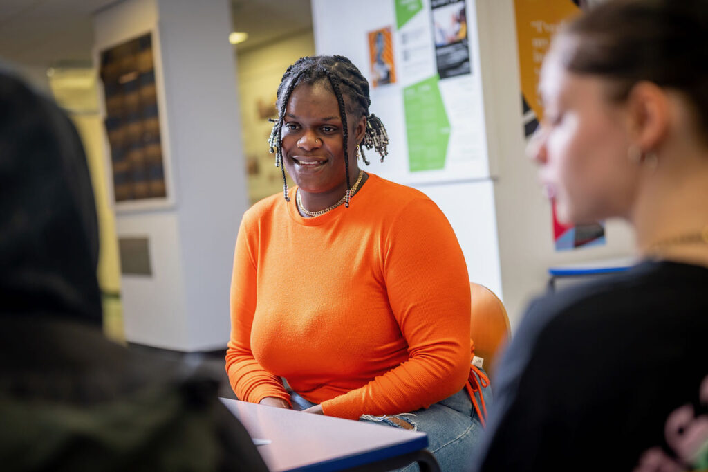 Students talking in a classroom