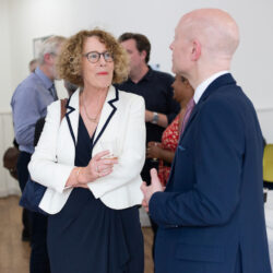 Andrew Gower talking with visitors to the College