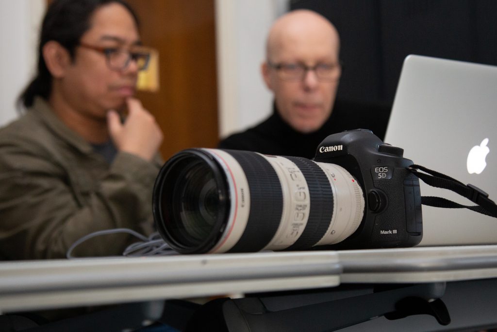 Students looking at a camera