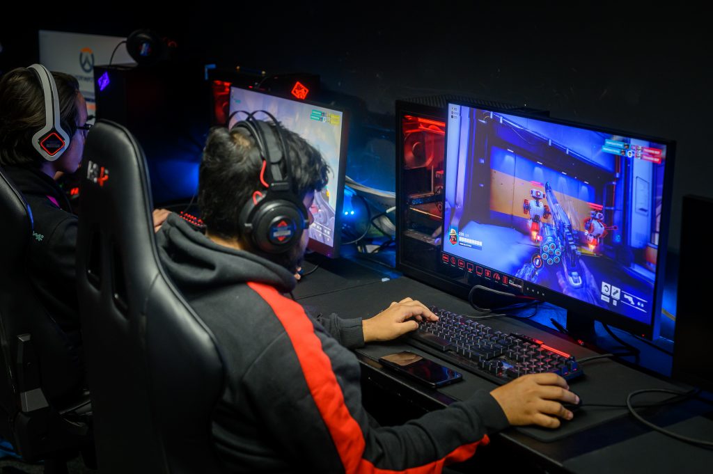 Student on computer in esports studio